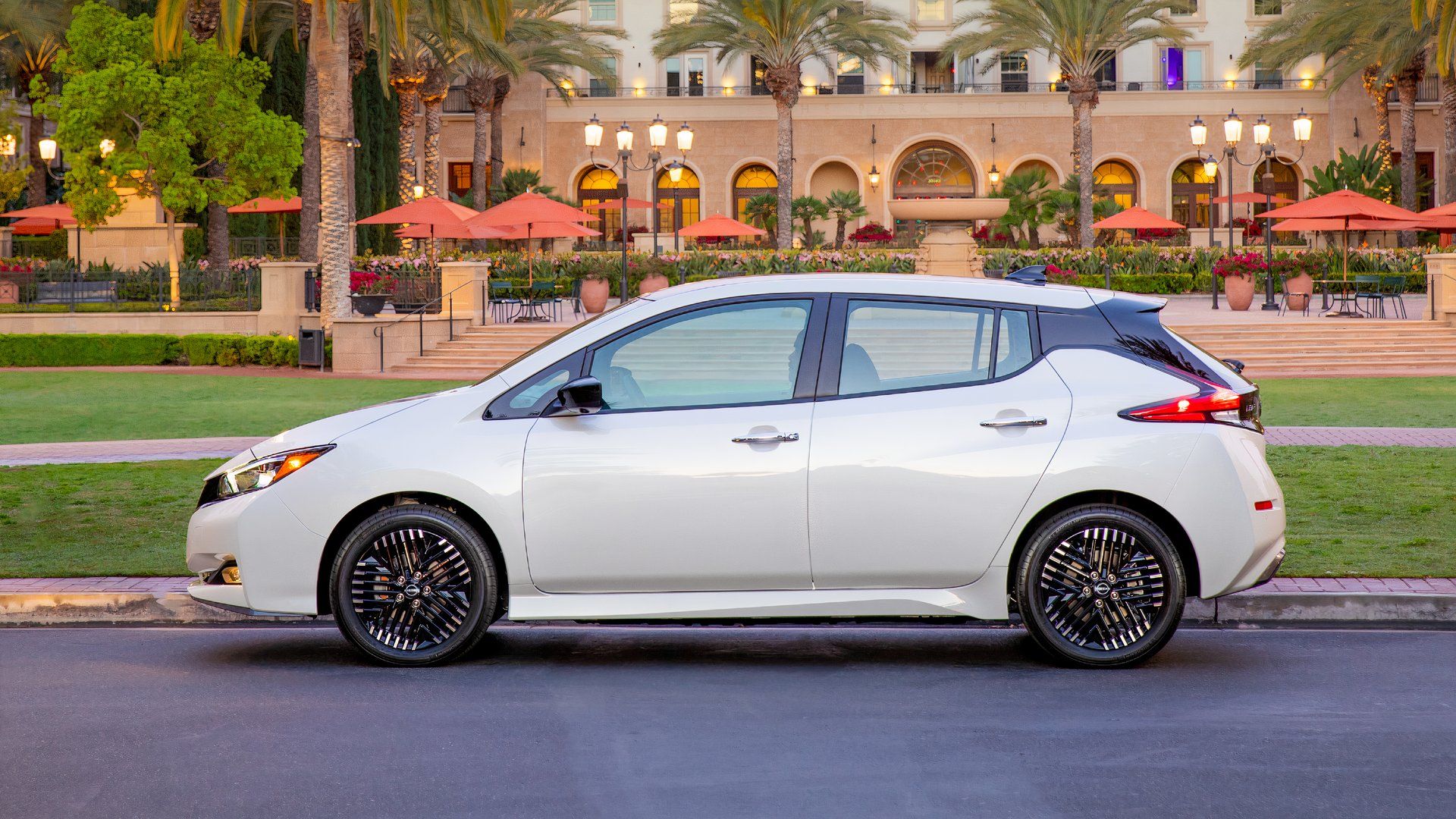 Side profile shot of a white 2023 Nissan LEAF