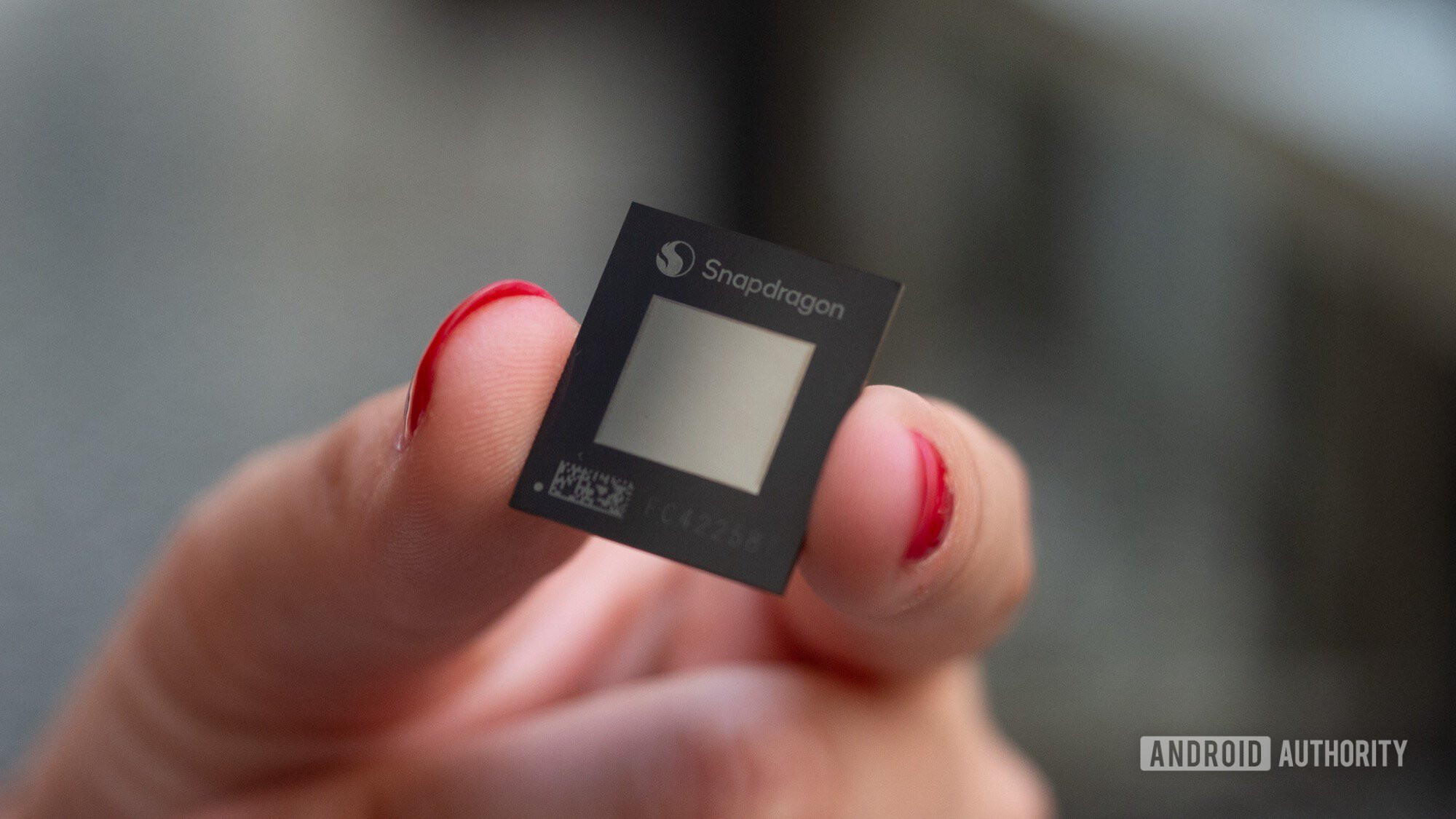 qualcomm snapdragon x plus chip in hand