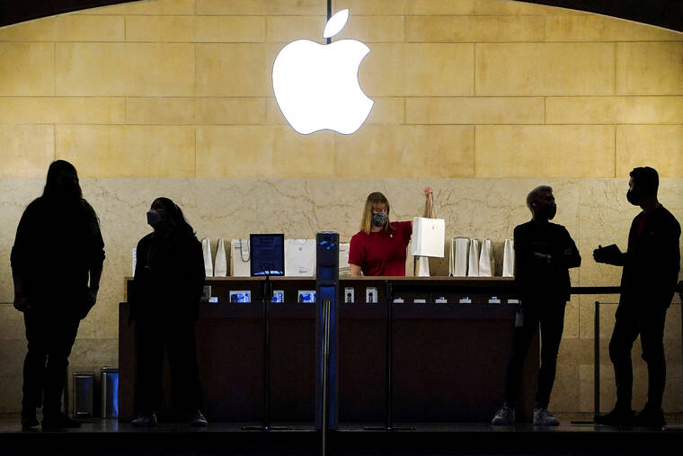 REUTERS/CARLO ALLEGRI/FILE PHOTO
                                Apple employees work in an Apple Store at the Grand Central Terminal in the Manhattan borough of New York City, in January 2022. The U.S. National Labor Relations board accused Apple of interfering with workers rights to collectively advocate for better working conditions by restricting their use of social media and workplace messaging app Slack, the agency said today.