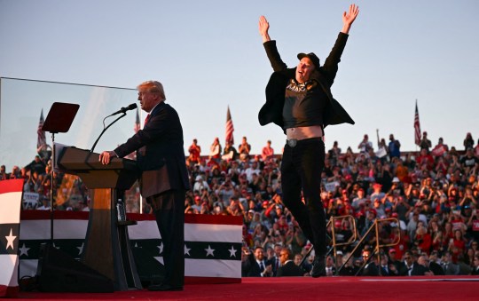 Tesla and SpaceX CEO Elon Muskjumps on stage as he joins former US President and Republican presidential candidate Donald Trump during a campaign rally at site of his first assassination attempt in Butler, Pennsylvania on October 5, 2024. 