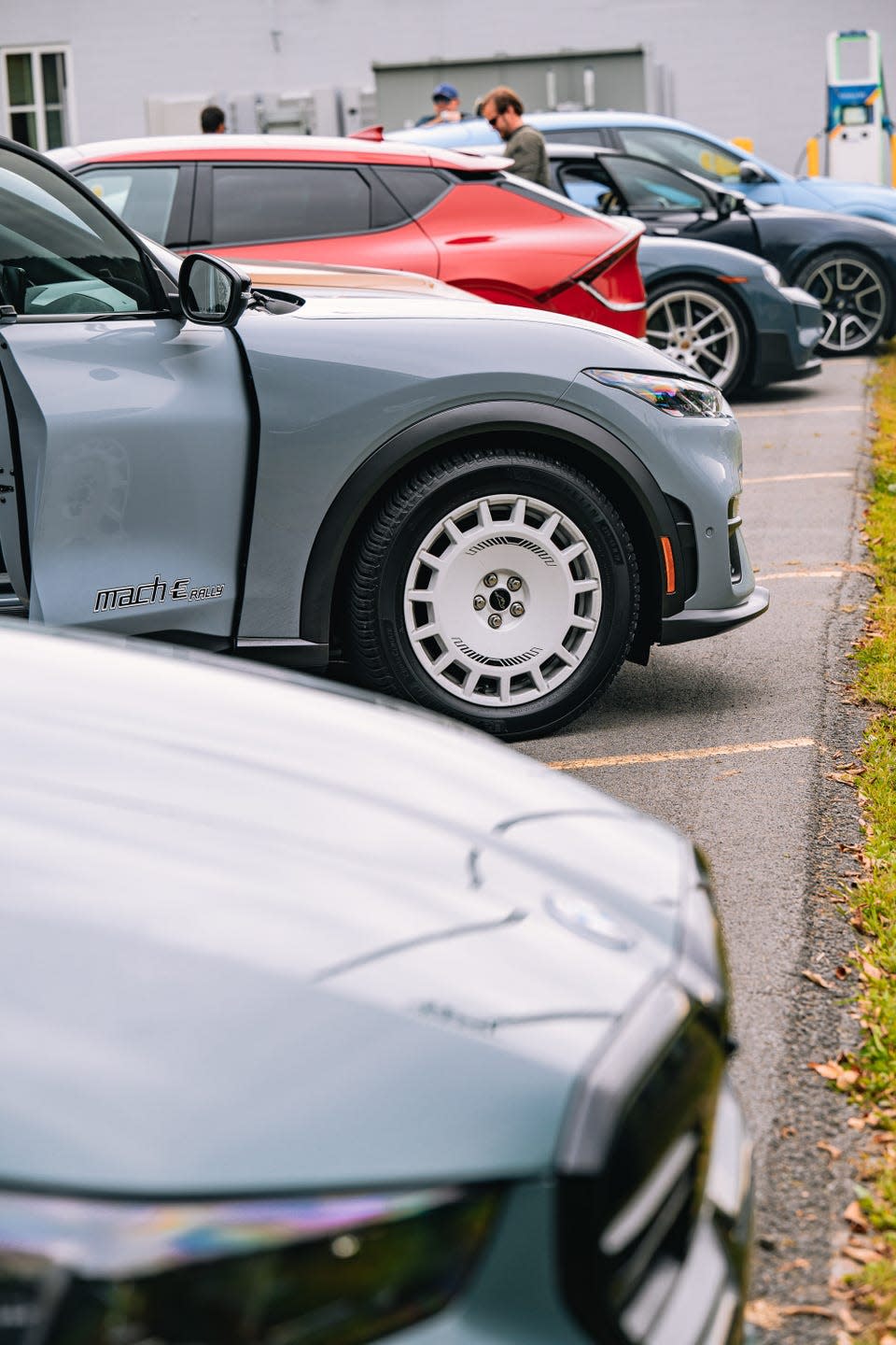 row of electric vehicles parked in a lot