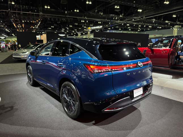 Rear 3/4 view of a blue Nissan Murano