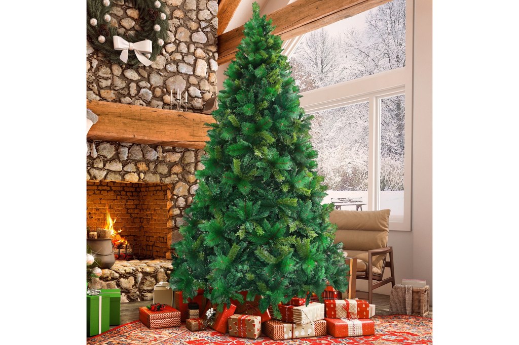 A Christmas tree in a room with presents