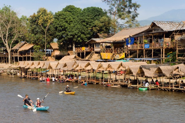 CRBADF Tourists kayaking in the Water Fun Park on Nam Song River, Vang Vieng, Vientiane, Laos, Indochina, Asia