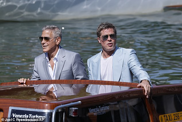 Pitt and Clooney were reportedly paid $35 million each to act in the caper film, and had insisted on a release in cinemas but it ultimately was released on the AppleTV+ streaming service; the two are seen arriving for the Venice Film Festival premiere in September