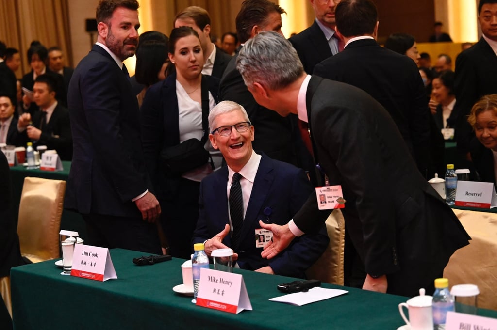 Apple CEO Tim Cook (centre) attends the China Development Forum in Beijing on March 24, 2024. Photo: AFP