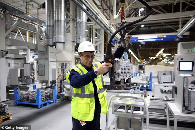 A Ford worker at the company's Dagenham plant. The company plans to cut 800 jobs, largely in administrative and product development roles