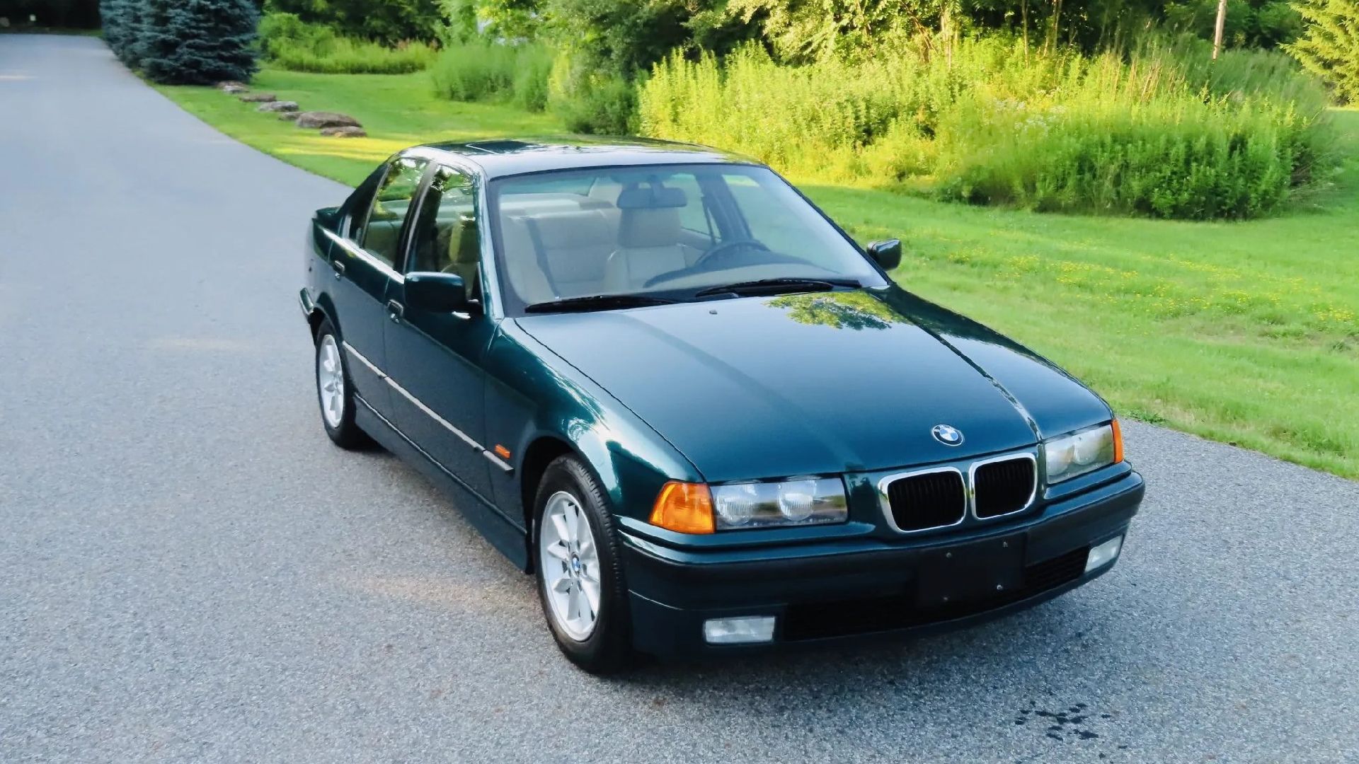 A Green BMW 328i Sedan E36