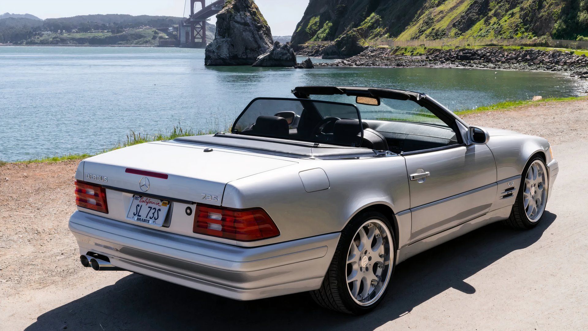 1999 Mercedes SL 73 Brabus rear 3/4 exterior shot with the top down