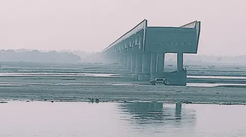 ANI A photo of the bridge over the Ramganga river from which the car fell