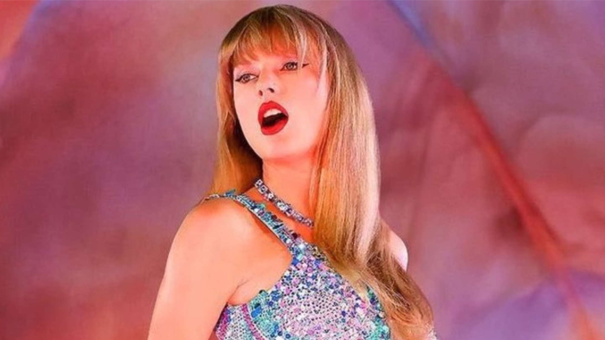 Taylor Swift performing on stage in Taylor Swift: The Eras Tour concert movie