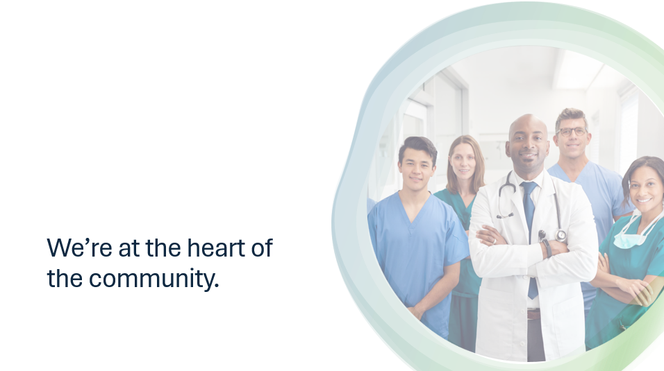 A PowerPoint slide containing a circular image of a group of doctors, and text saying 'We're at the heart of the community.'