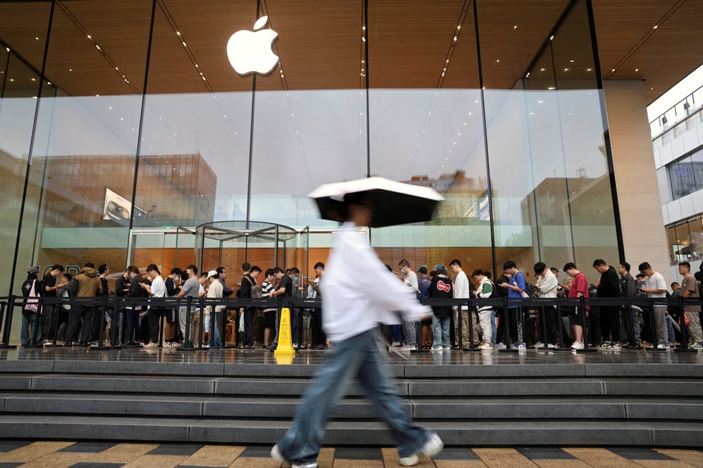 People line up outside an Apple store in Beijing as the iPhone 16 series went on sale in September. Photo: Reuters