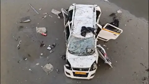 Anoop Mishra Photo of a car that fell of an unfinished bridge in Uttar Pradesh state.