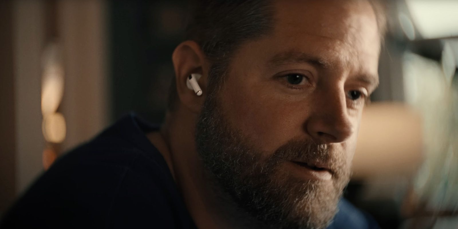 Heartwarming Apple holiday ad showcases AirPods Pro 2 hearing aid feature | Father using AirPods to hear his family