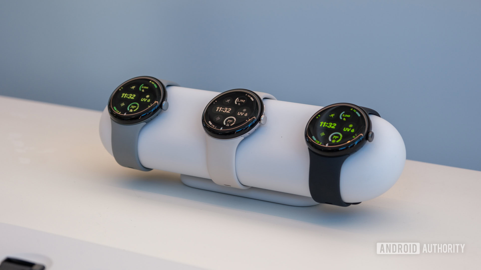 A selection of Google Pixel Watch 3s rest on a stand.