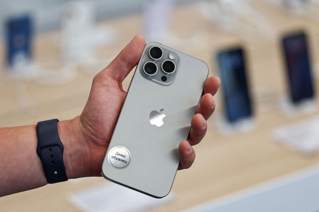 A man holds an Apple iPhone 16 Pro Max ahead of the launch of sales of the new iPhone 16 series smartphones in a store in Moscow, Russia September 20, 2024.