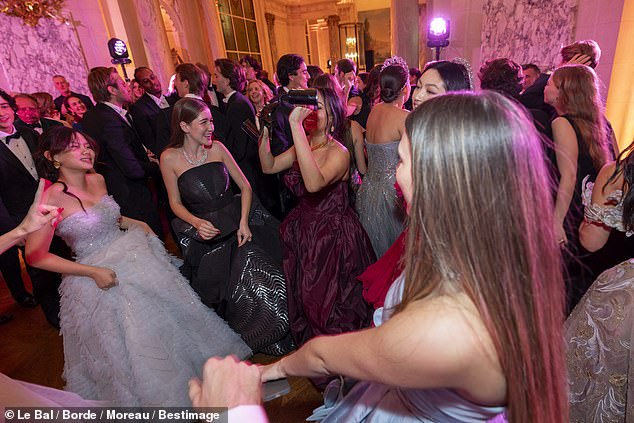 Pictured: Debutantes Sofia Yadigaroglu (wearing Iris van Herpen) and Sophie Kodjoe (wearing Oscar de la Renta) on the dancefloor