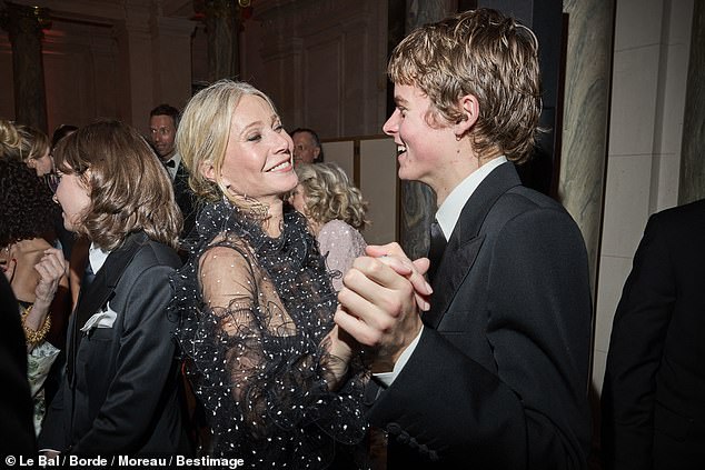 Pictured: A-List actress Gwyneth Paltrow dancing with her son Moses Martin at the debutante ball in Paris