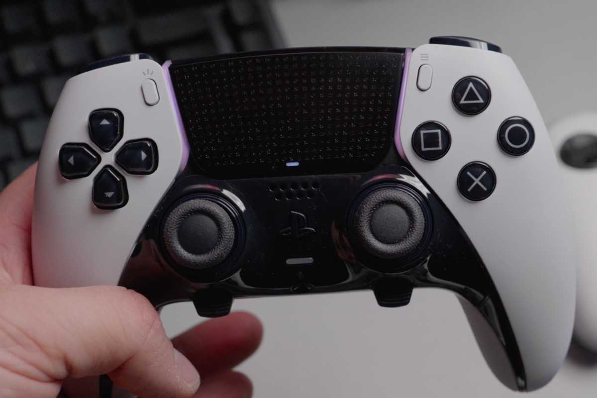 Sony PlayStation wireless gaming controller in hand