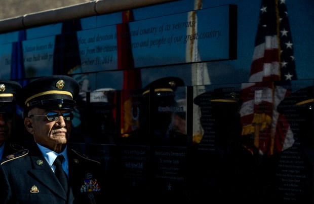 The colors are reflected in the honor wall on Saturday,...