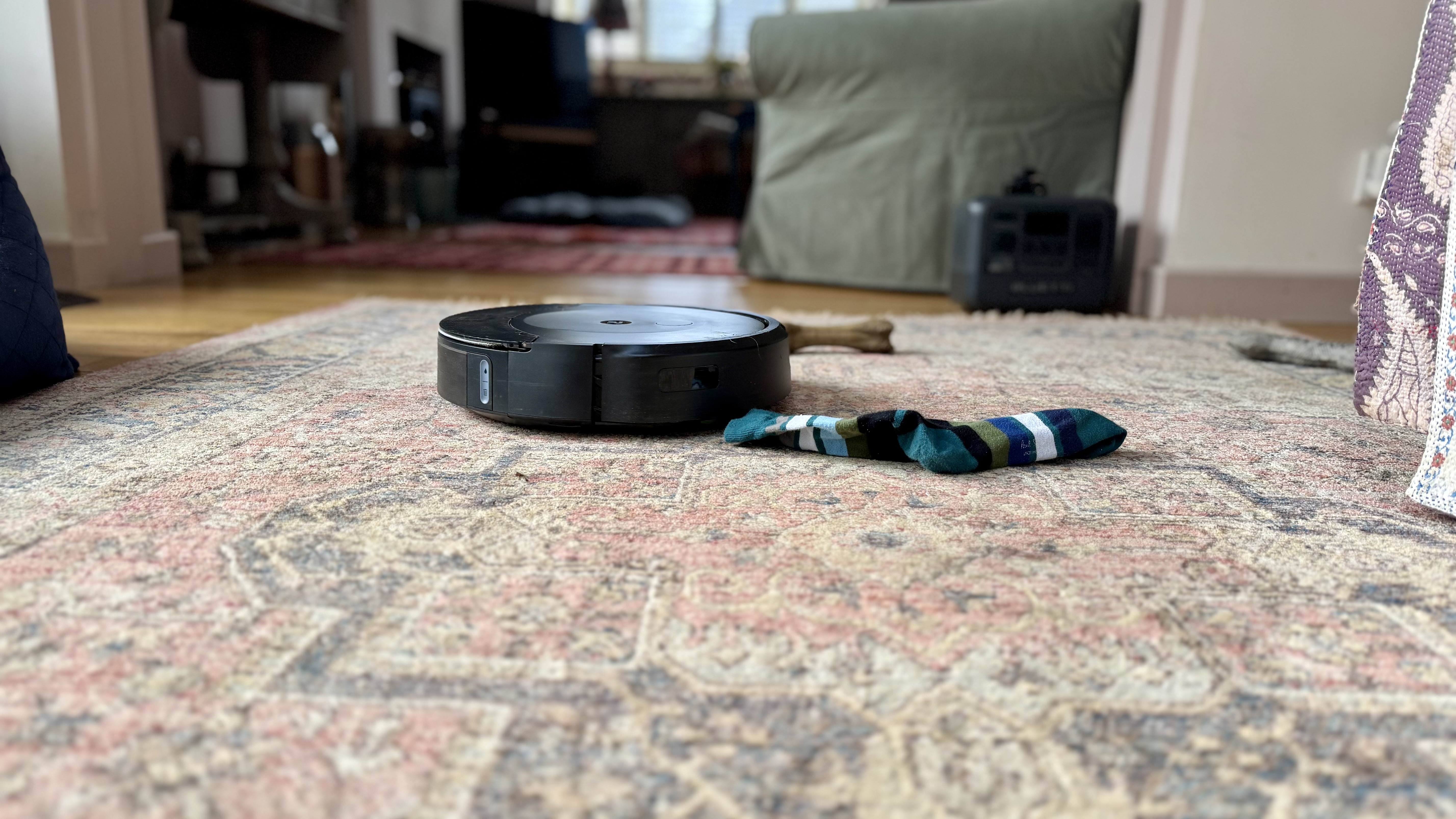 iRobot Roomba Combo 10 Max trying to avoid obstacles, including a sock and dog toy