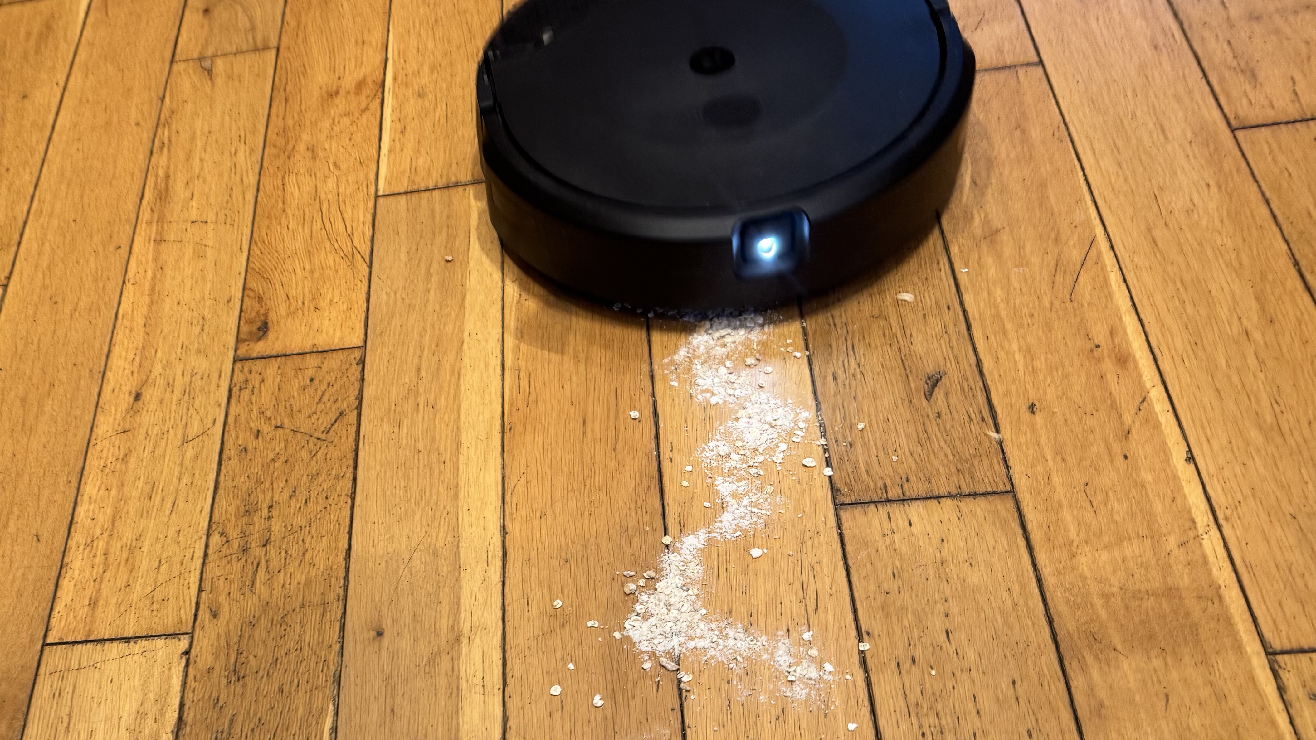 Hard floor with dry debris spillage before cleaning with Roomba Combo 10 Max 