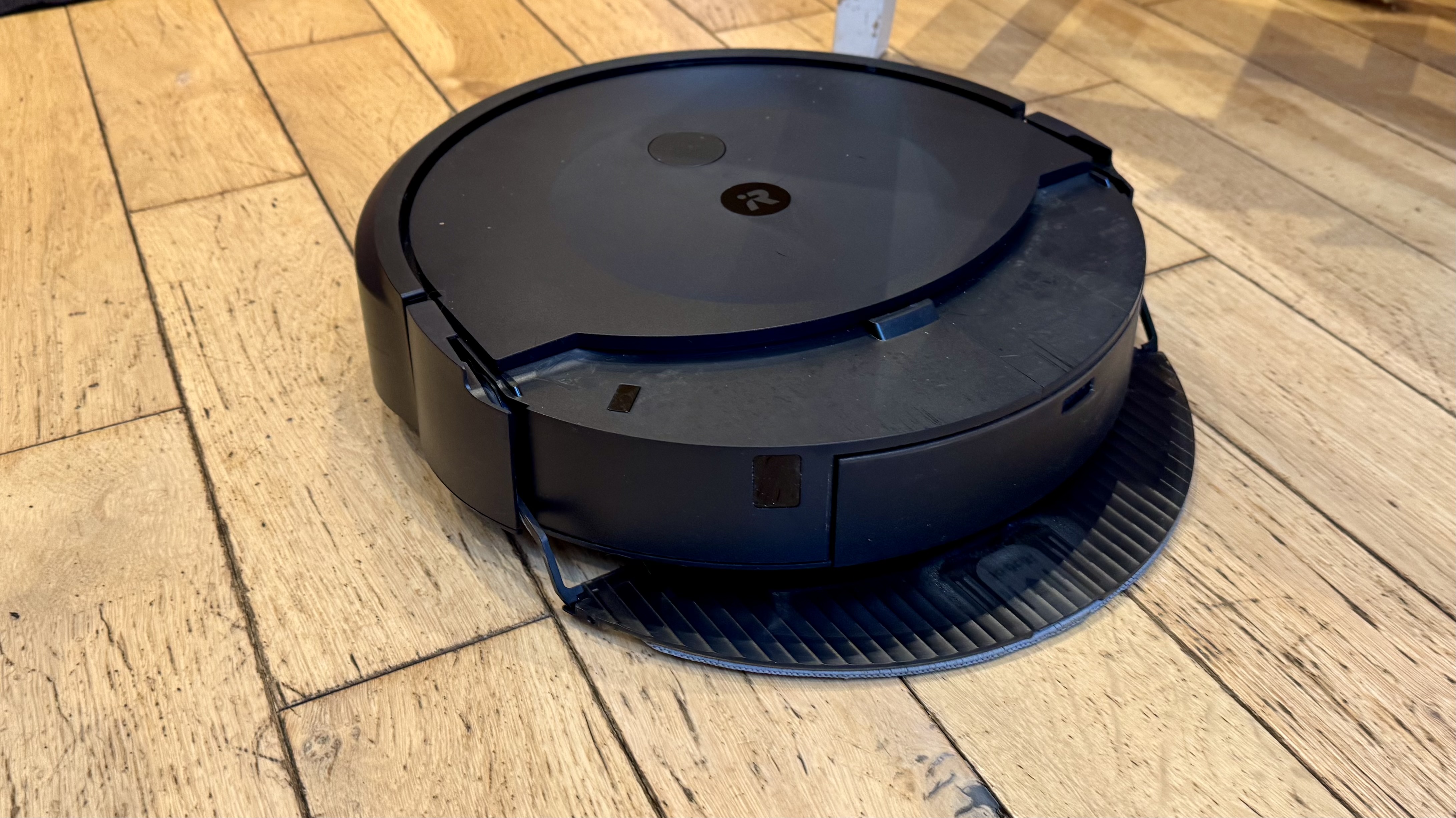 iRobot Roomba Combo 10 Max mopping a wooden floor