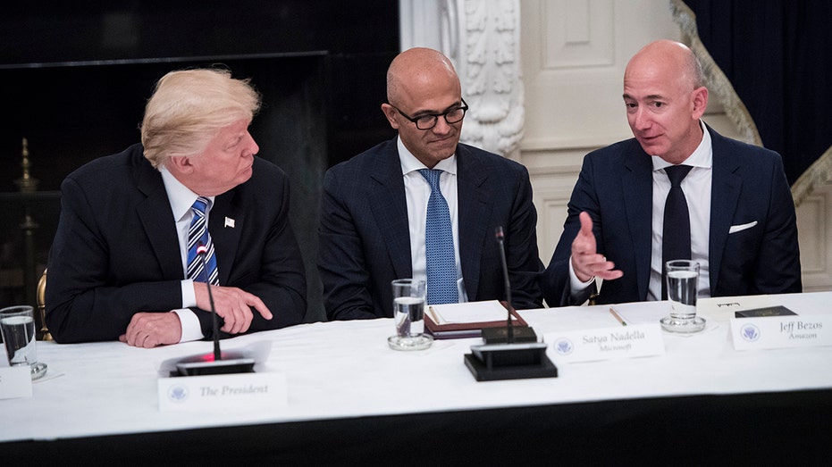 Amazon CEO Jeff Bezos speaking with Trump and Microsoft CEO Satya Nadella