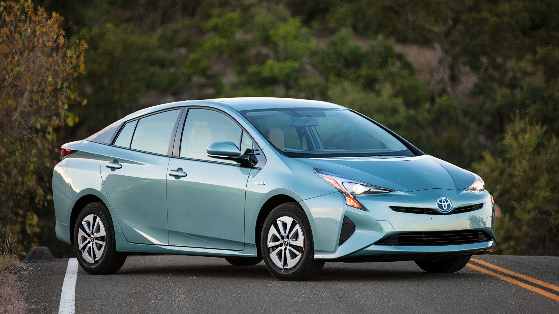 A blue 2017 Toyota Prius hybrid small car.