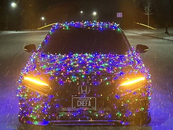 car snow with christmas lights