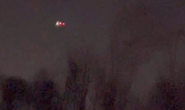 In this image taken from video, what appears to be drones flying over Randolph, New Jersey