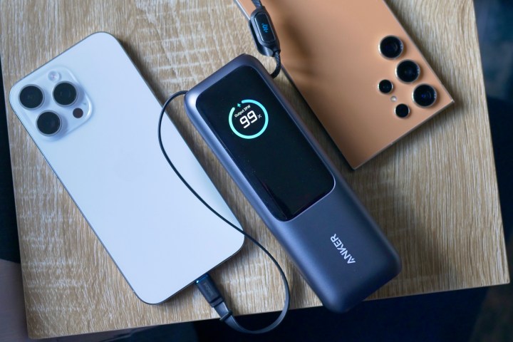 The Anker 165W Power Bank charging two phones.