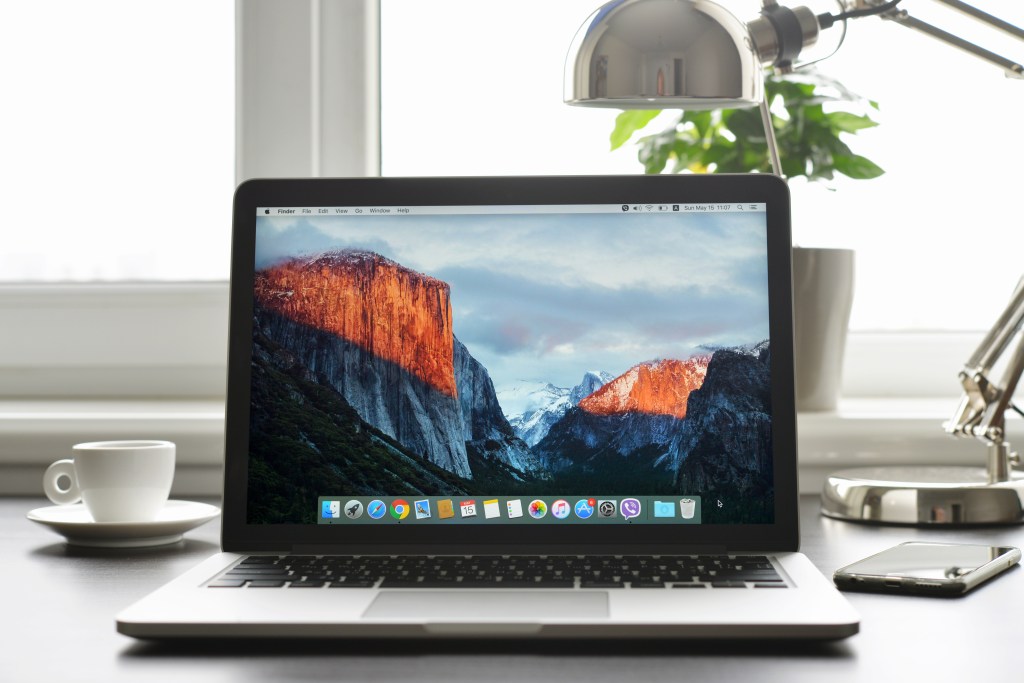 Brand new Macbook Pro with Retina display and OS X EL Capitan on a table