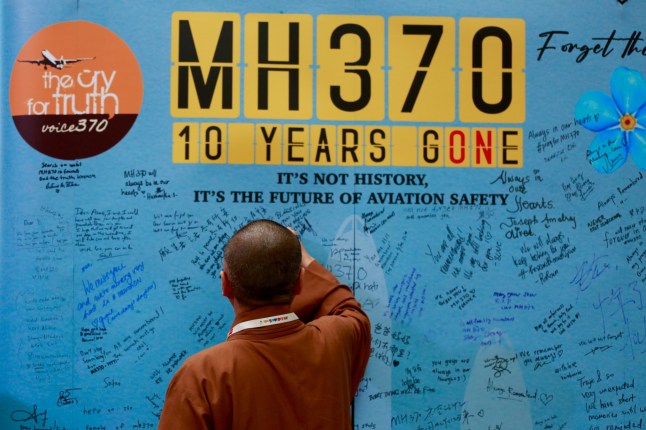 Visitors are writing messages at the Day of Remembrance for MH370 in Petaling Jaya, Malaysia, on March 3, 2024. Today marks the 10th anniversary of the disappearance of Flight MH370, a Boeing 777 aircraft with 239 people on board, which vanished from radar screens on March 8, 2014, while flying from Kuala Lumpur to Beijing. (Photo by Supian Ahmad/NurPhoto via Getty Images)