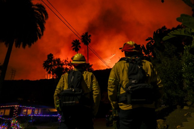 CALIFORNIA, USA - JANUARY 10: A view of wild fire as firefighting planes and helicopters drop water over flames in Mandeville Canyon during 'Palisades Fire' in Los Angeles, California, United States on January 10, 2025. (Photo by Tayfun Coskun/Anadolu via Getty Images)