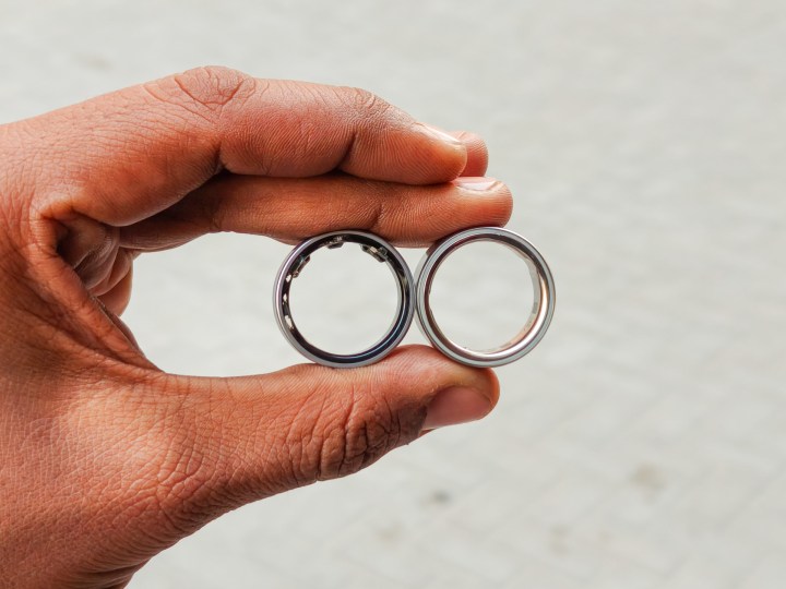 Oura RIng 4 and Galaxy Ring in the hand.