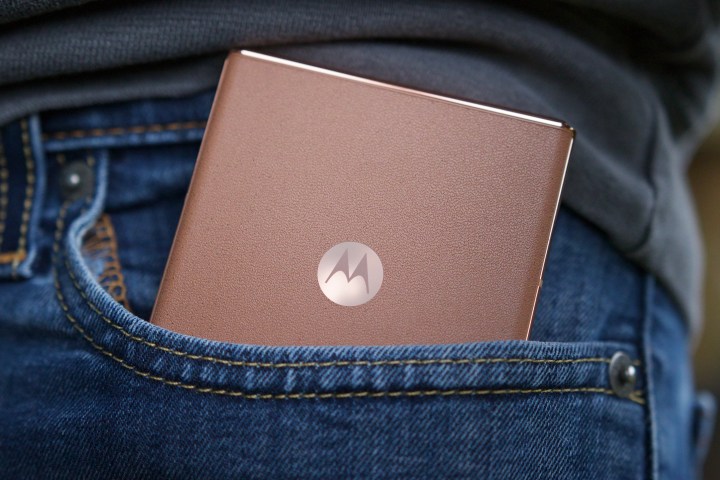 The Mocha Mousse Motorola Razr Plus in someone's pocket.