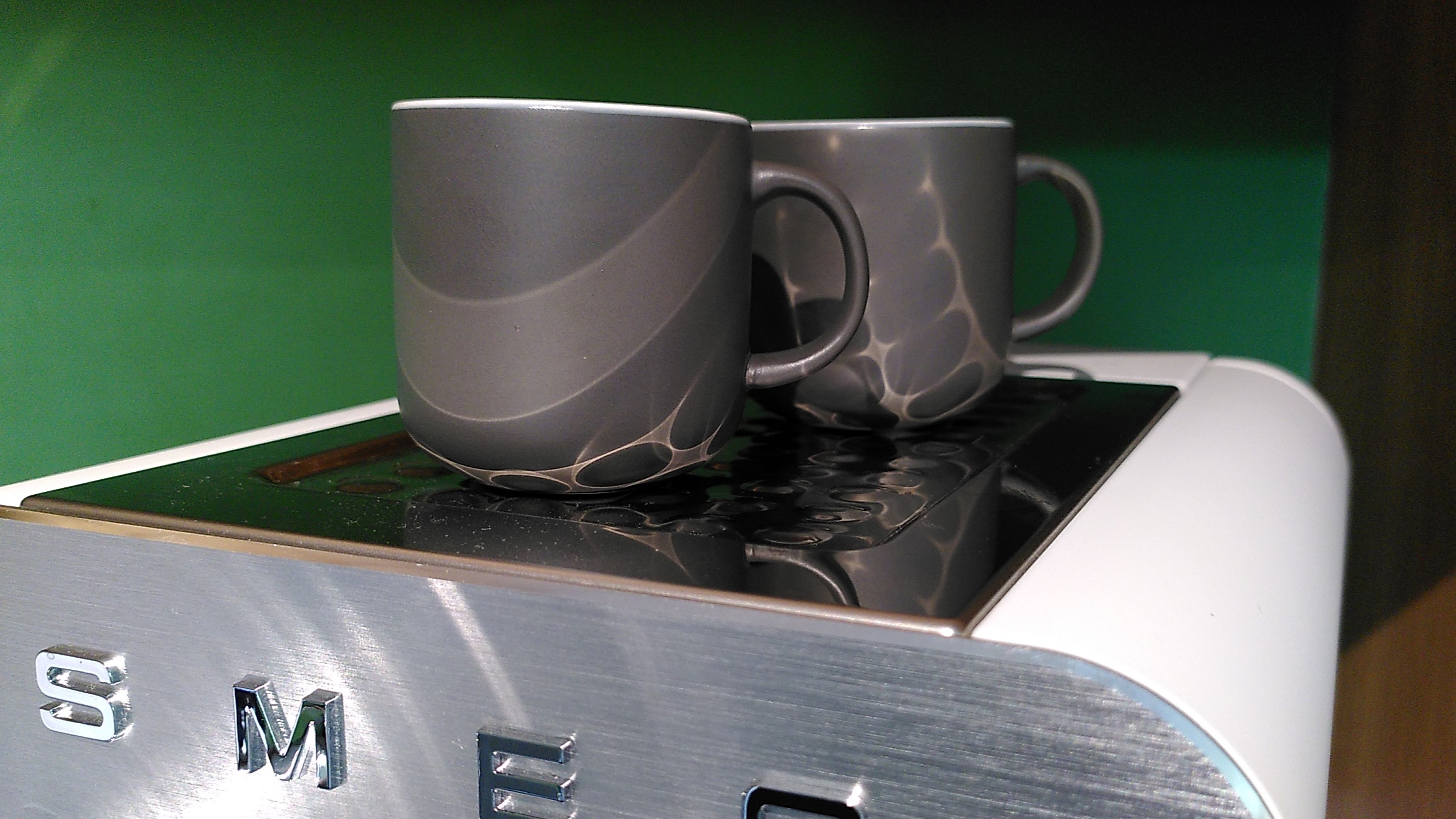 Cups being warmed on Smeg Mini Pro Espresso Coffee Machine