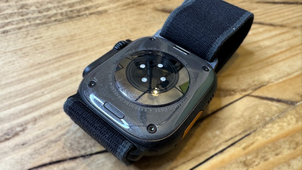 smartwatch with a rugged design and a strap displaying its back features