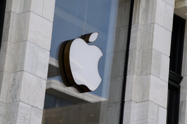 (FILES) The Apple logo is seen at the entrance of an Apple store in Washington, DC, on September 14, 2021. The EU on March 4, 2024 hit Apple with a 1.8-billion-euro fine ($1.9 billion) for violating the bloc's laws by preventing music streaming services from informing users about subscription options outside of its App Store. (Photo by Nicholas Kamm / AFP) (Photo by NICHOLAS KAMM/AFP via Getty Images)