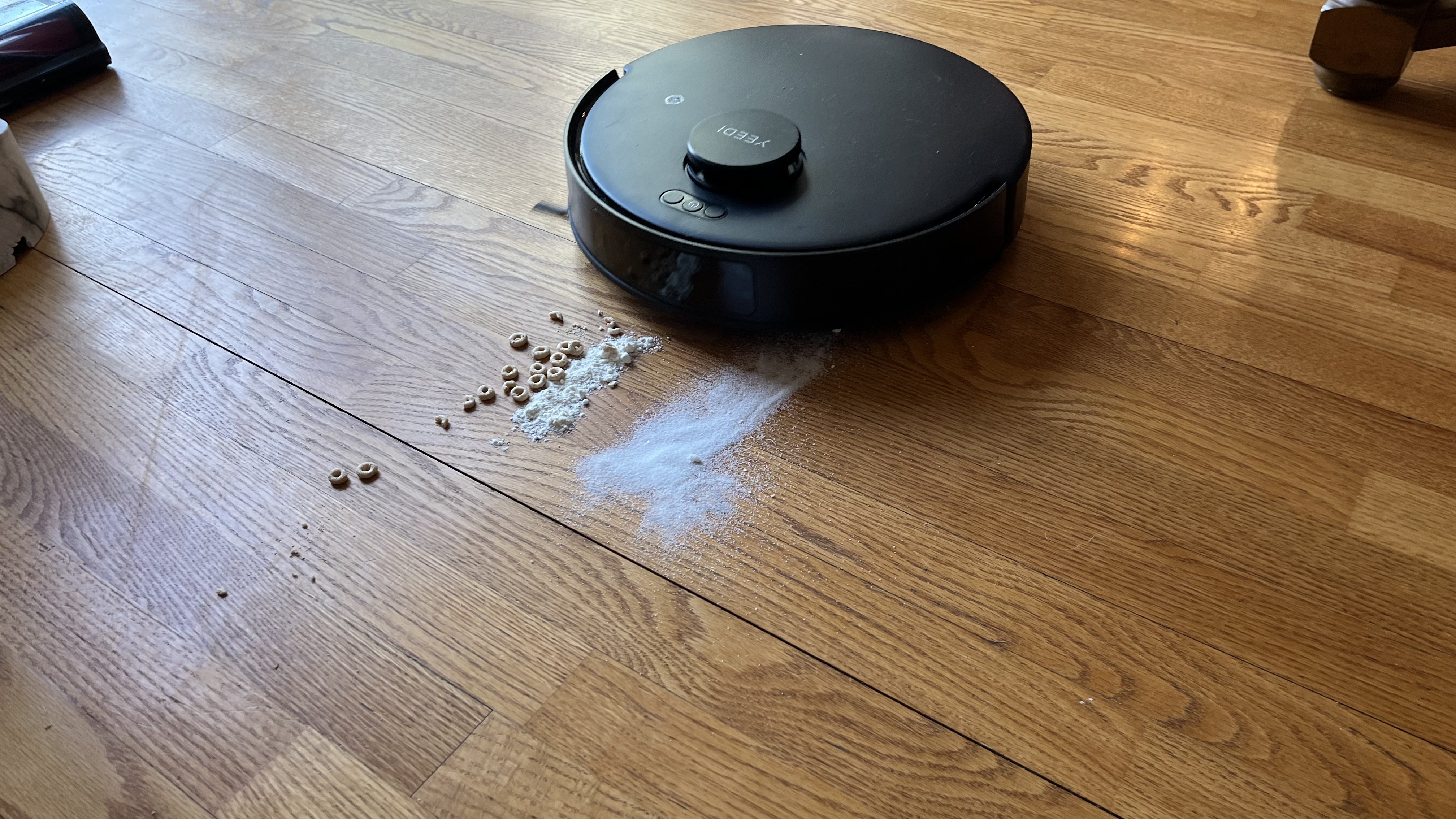 Yeedi C12 Combo robot vacuum cleaning up cereal, sugar, flour