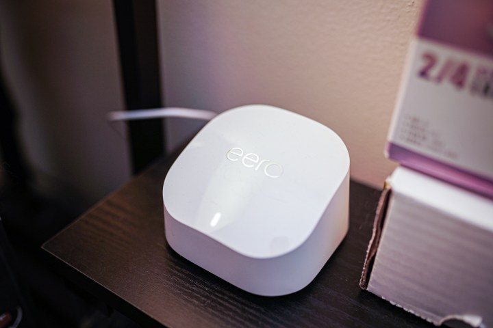 The Eero 6+ router sitting on a desk.