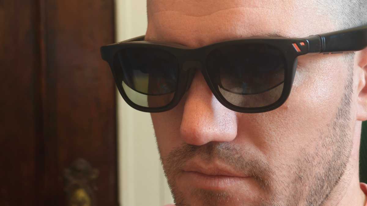 Man wearing AR XR glasses on face