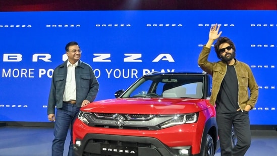 Actor Kartik Aryan and a representative for Maruti Suzuki India, Partho Bannerjee, launched a new marketing campaign for the Maruti Brezzaa at the expo.(Sanjay Sharma)