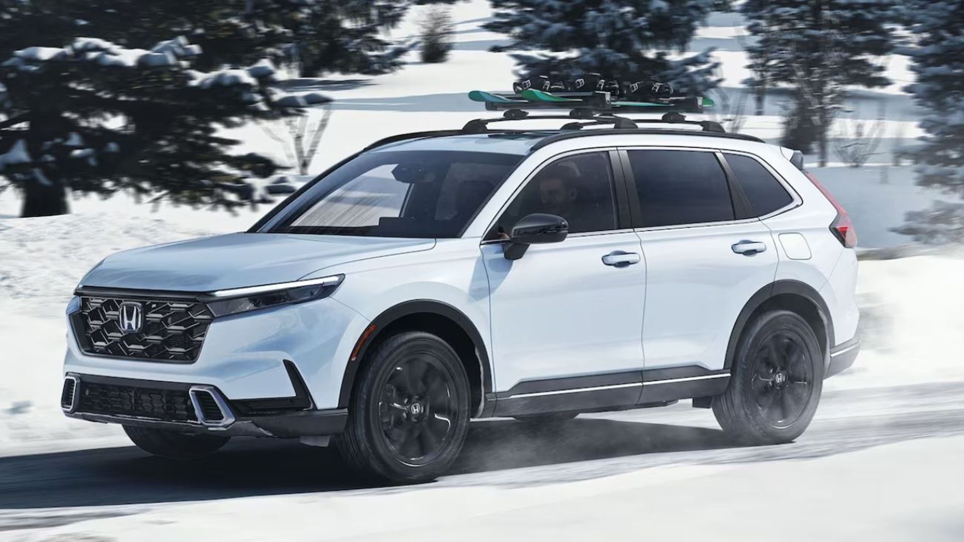 2024 Honda CR-V Hybrid driving through the snow