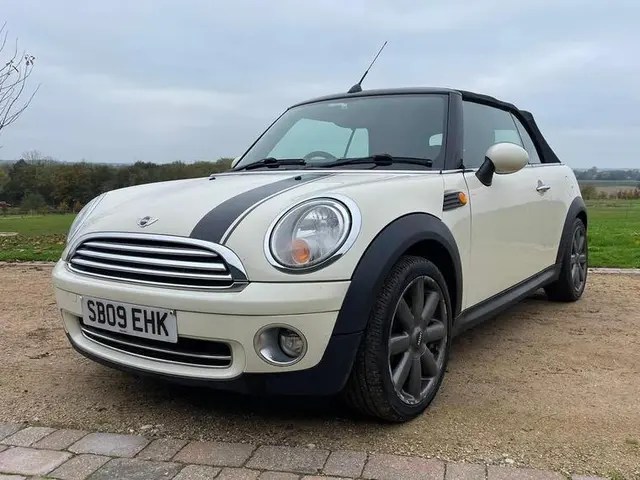 White Mini Cooper convertible.