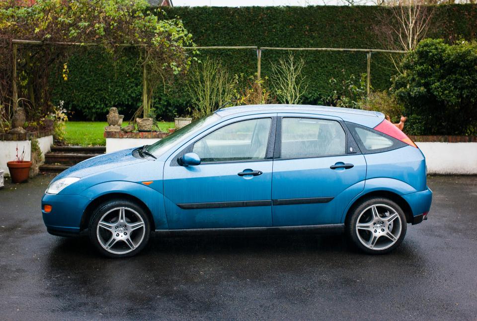 Blue Ford Focus car.