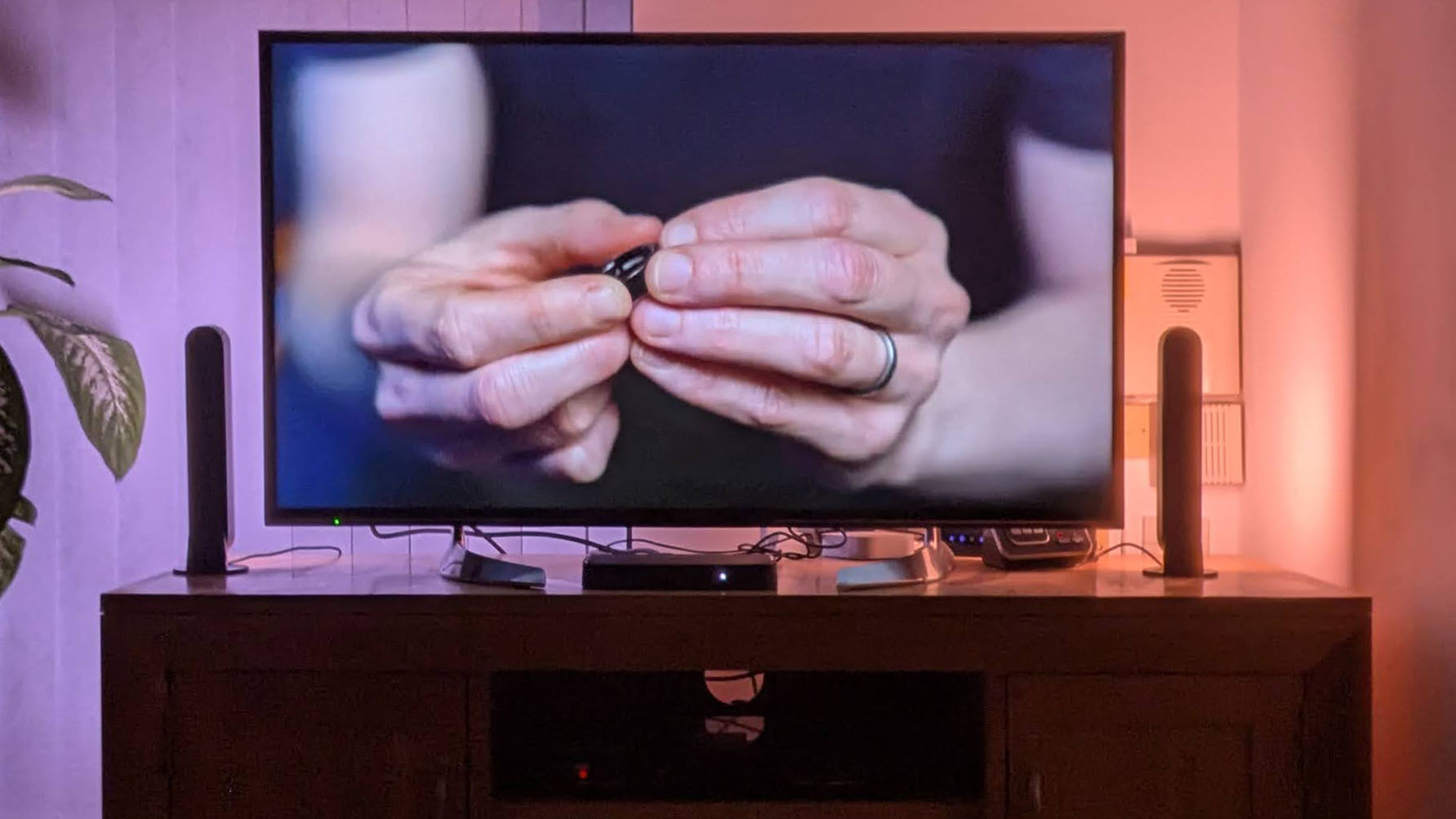 Soft colored image shown on TV with Philips Hue Play Light Bars beside it