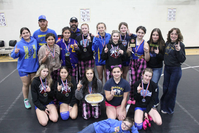 Tonasket Tigers Girls Wrestling with their apple pie after winning their first-ever Girls Apple Pie Tournament on Jan. 18. Submitted photo